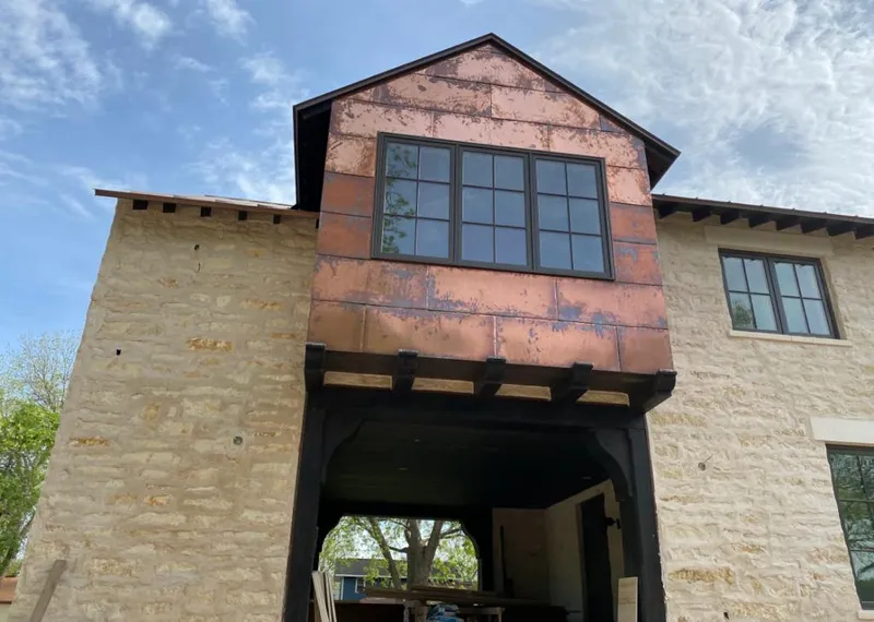 Copper metal panel facade on a stone building for Skylight Installation in Lehigh Acres